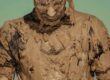 man in brown and black crew neck shirt
